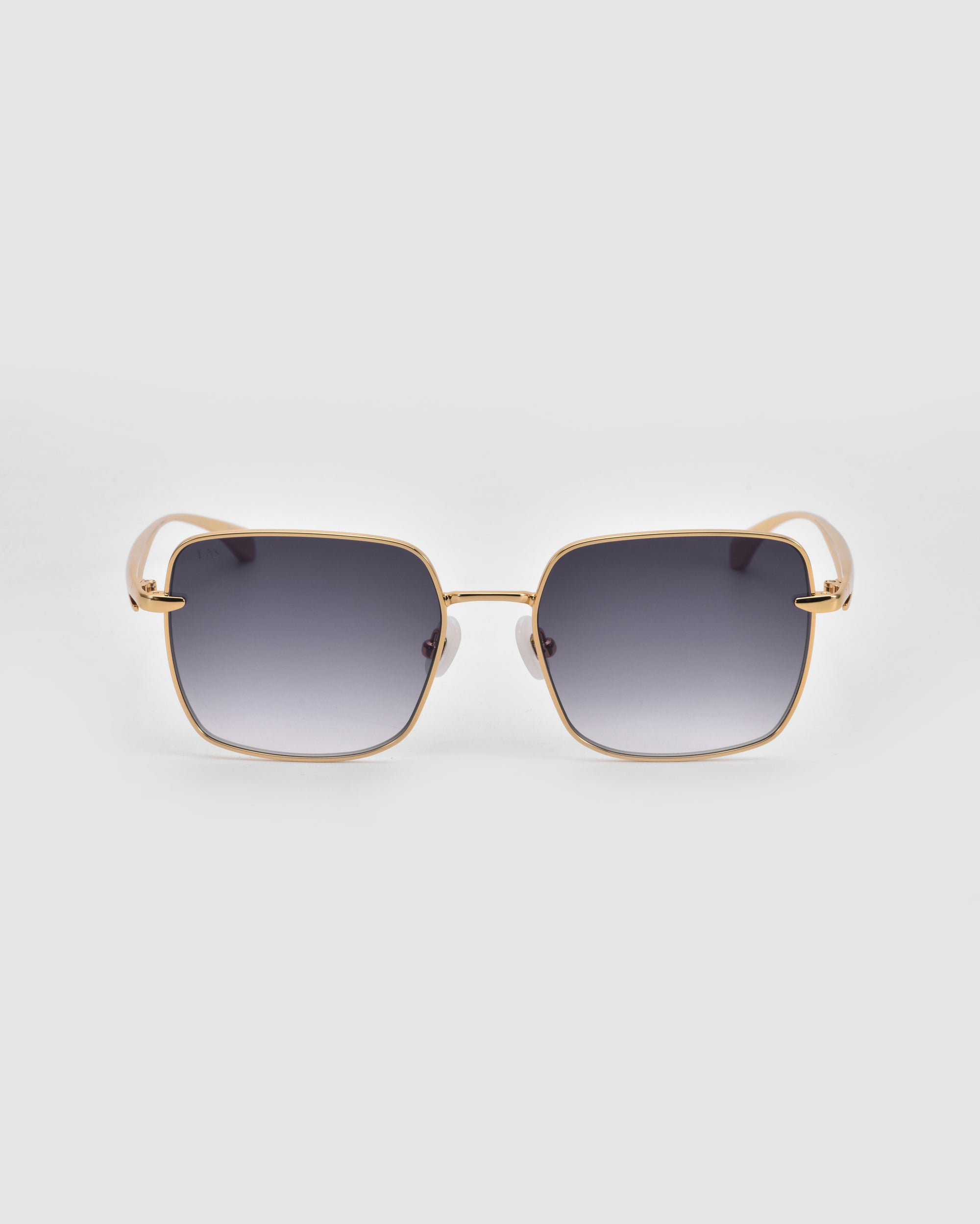 For Art's Sake® Edge sunglasses with a rectangular silhouette and gold metal frames, featuring dark gradient lenses, are displayed against a plain light gray background.