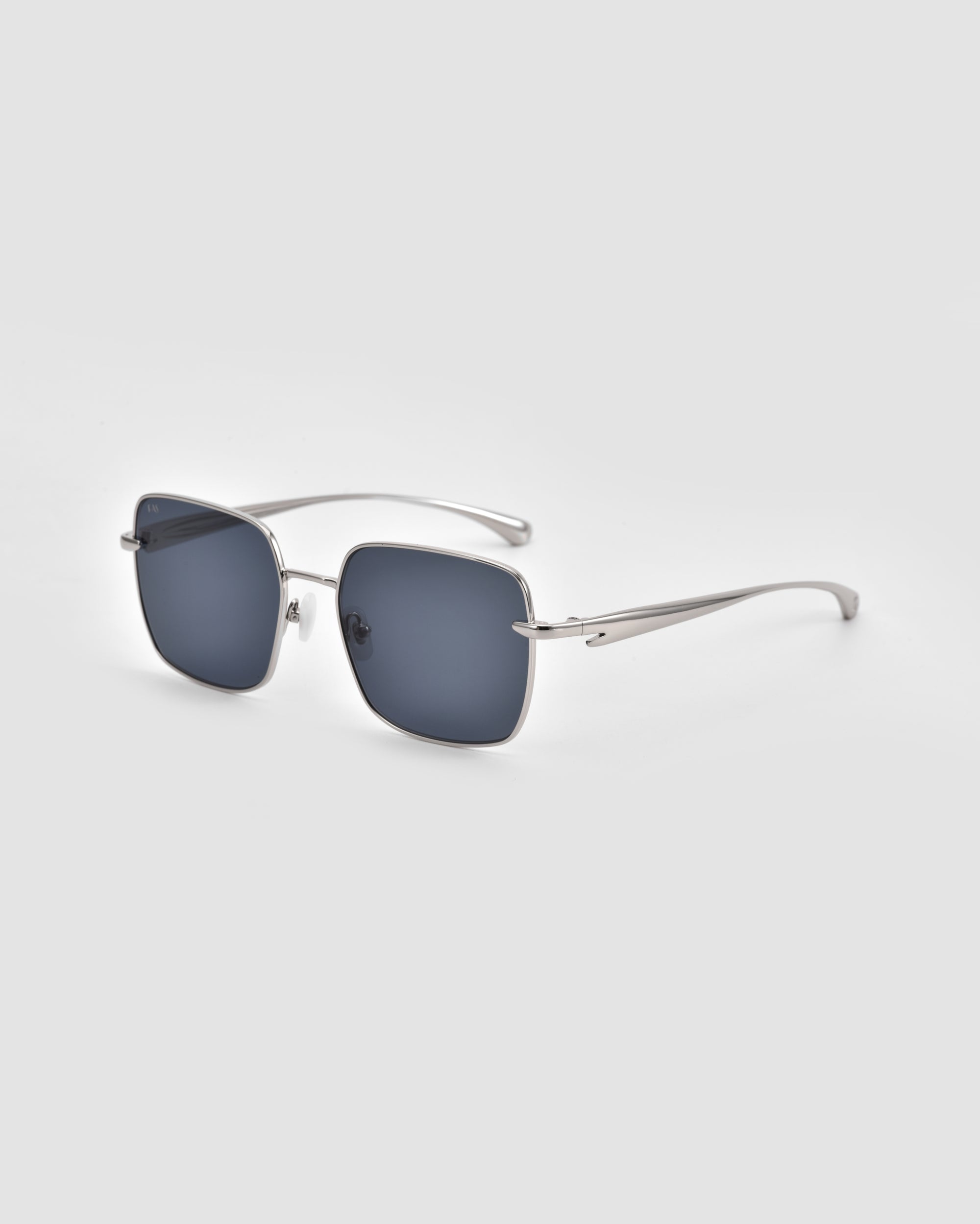 The For Art's Sake® Edge sunglasses feature a rectangular silhouette with dark lenses and slim silver metal frames, shown against a plain light gray background.