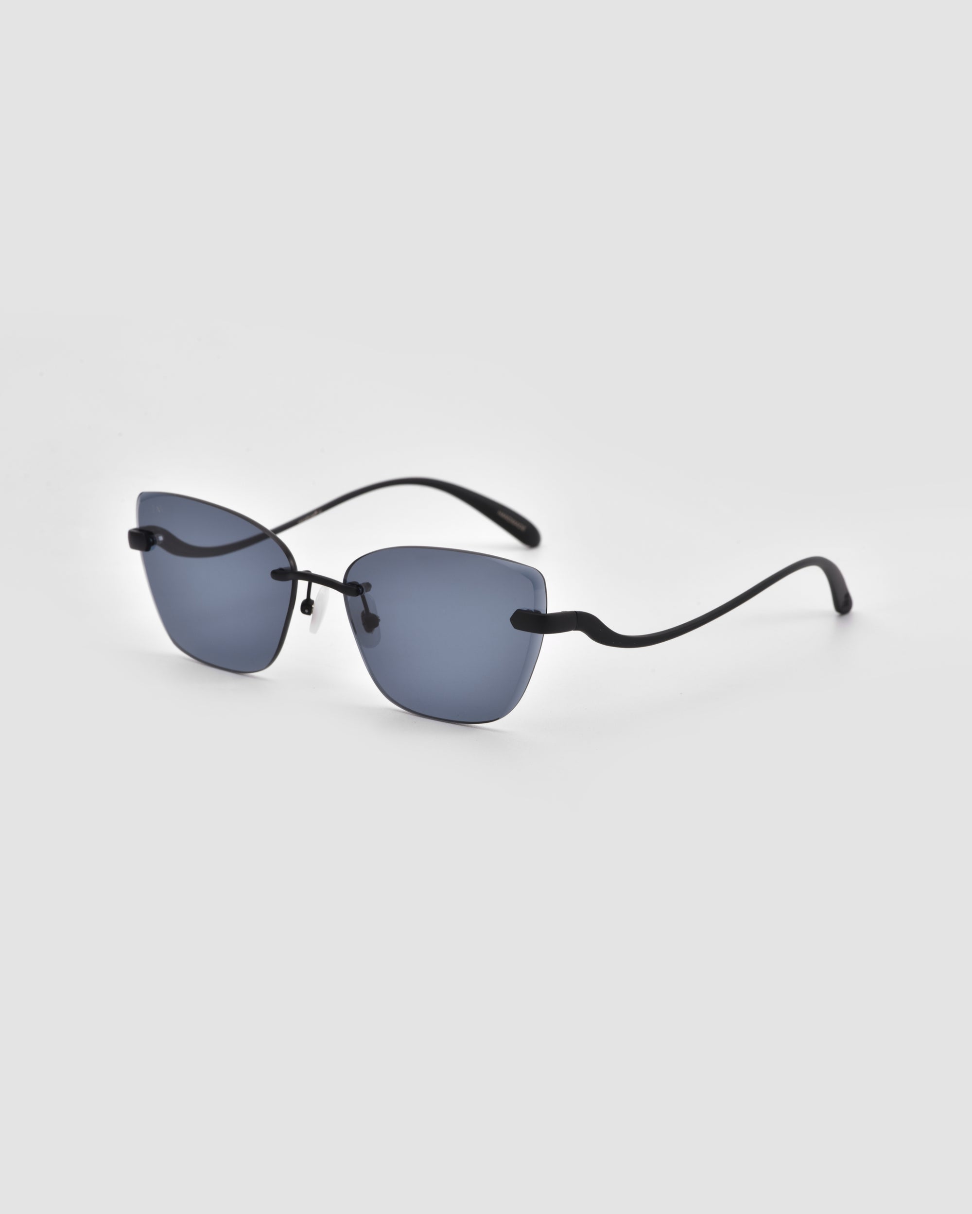 The For Art's Sake® Spark sunglasses feature rectangular blue-tinted lenses and slim black arms, shown against a light gray background.