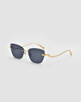 For Art's Sake® Spark features rimless cat-eye sunglasses with dark rectangular lenses and slim, curved gold metal arms, showcased on a light gray background for a bold, modern look.