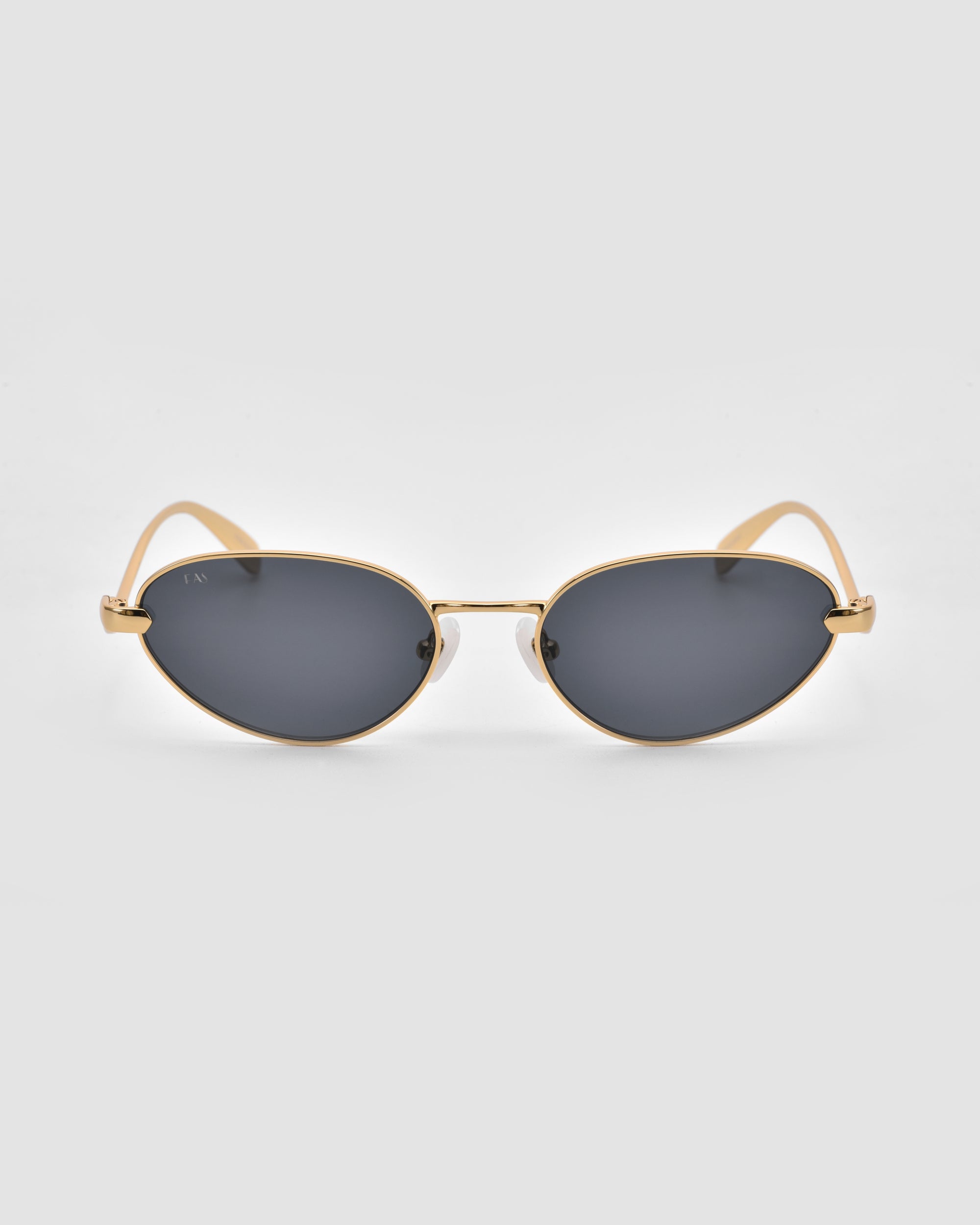 For Art's Sake® Rebirth sunglasses feature a sculptural 3D gold metal oval frame and dark tinted lenses, shown on a light grey background.