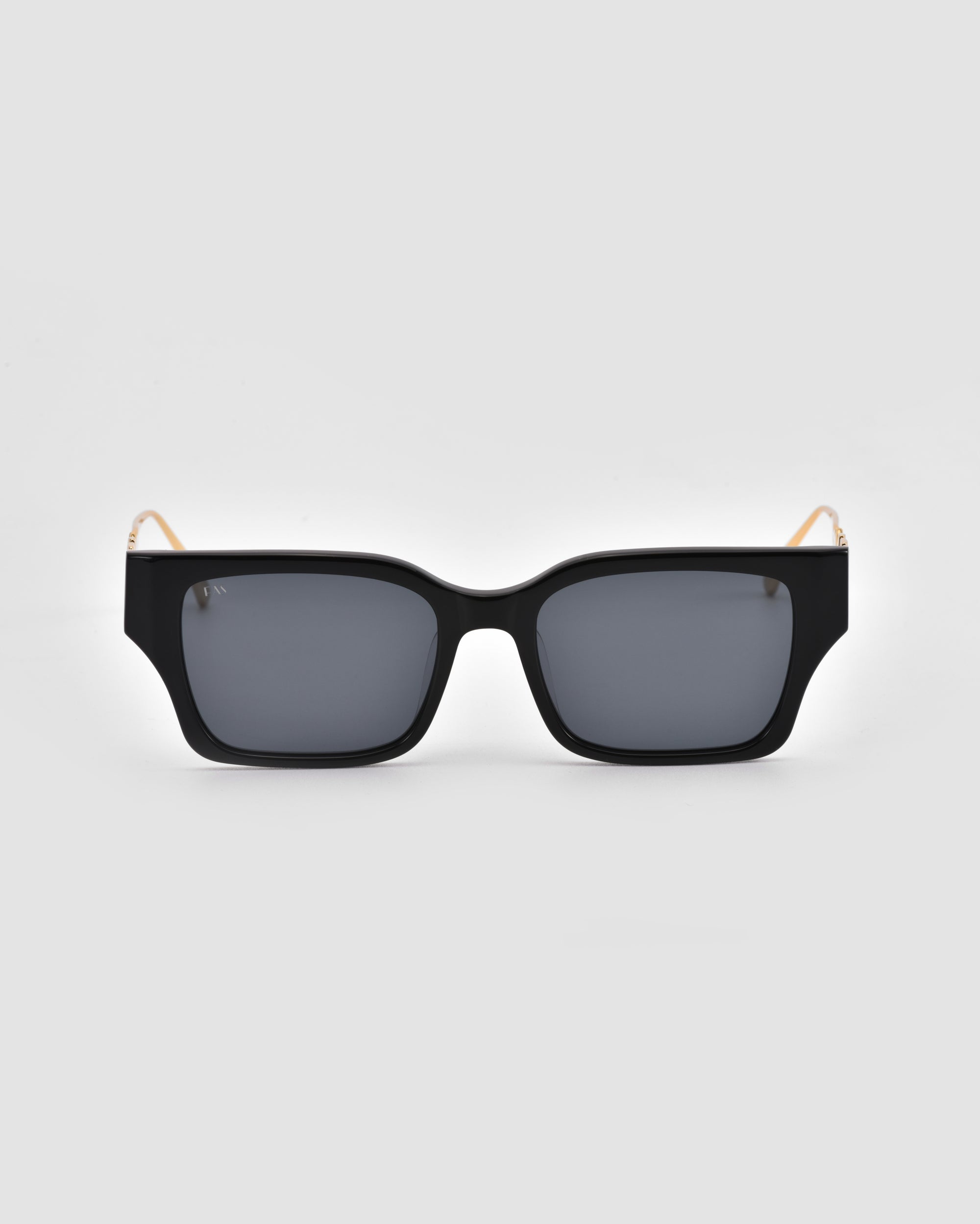 The For Art's Sake® Incomplete sunglasses feature a black rectangular boxy design with thick frames and dark tinted lenses, shown facing forward on a light gray background.