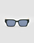 The For Art's Sake® Incomplete sunglasses feature boxy dark green frames, blue-tinted lenses, and mosaic metal details, shown against a light grey background.