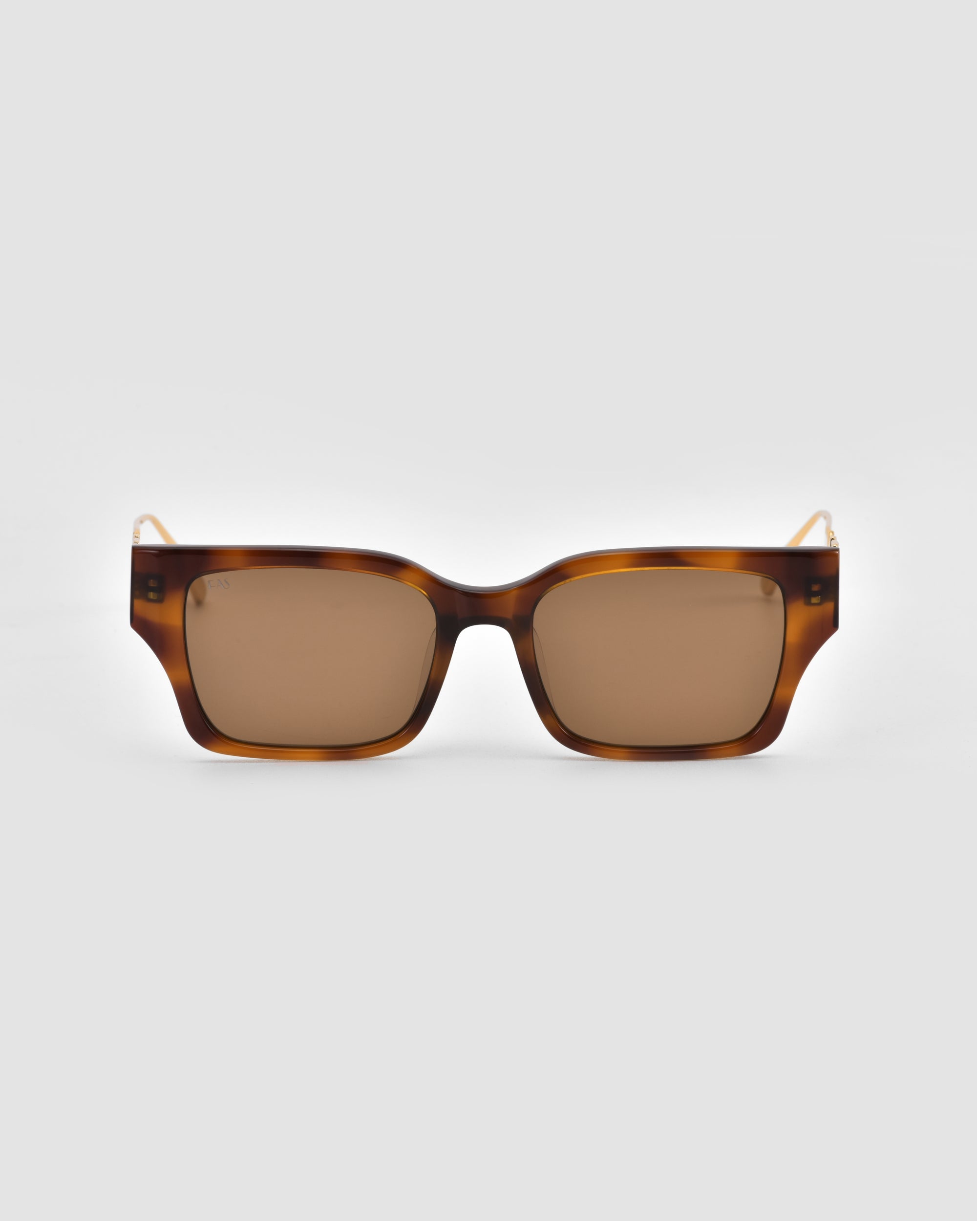 The Incomplete sunglasses by For Art's Sake® feature a mosaic metal design, rectangular tortoiseshell frames, and brown-tinted lenses. Shown from the front against a plain light gray background.