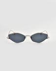 The Moment sunglasses by For Art's Sake® feature a sleek metal frame with silver accents and angular dark lenses, shown facing forward on a light gray background.