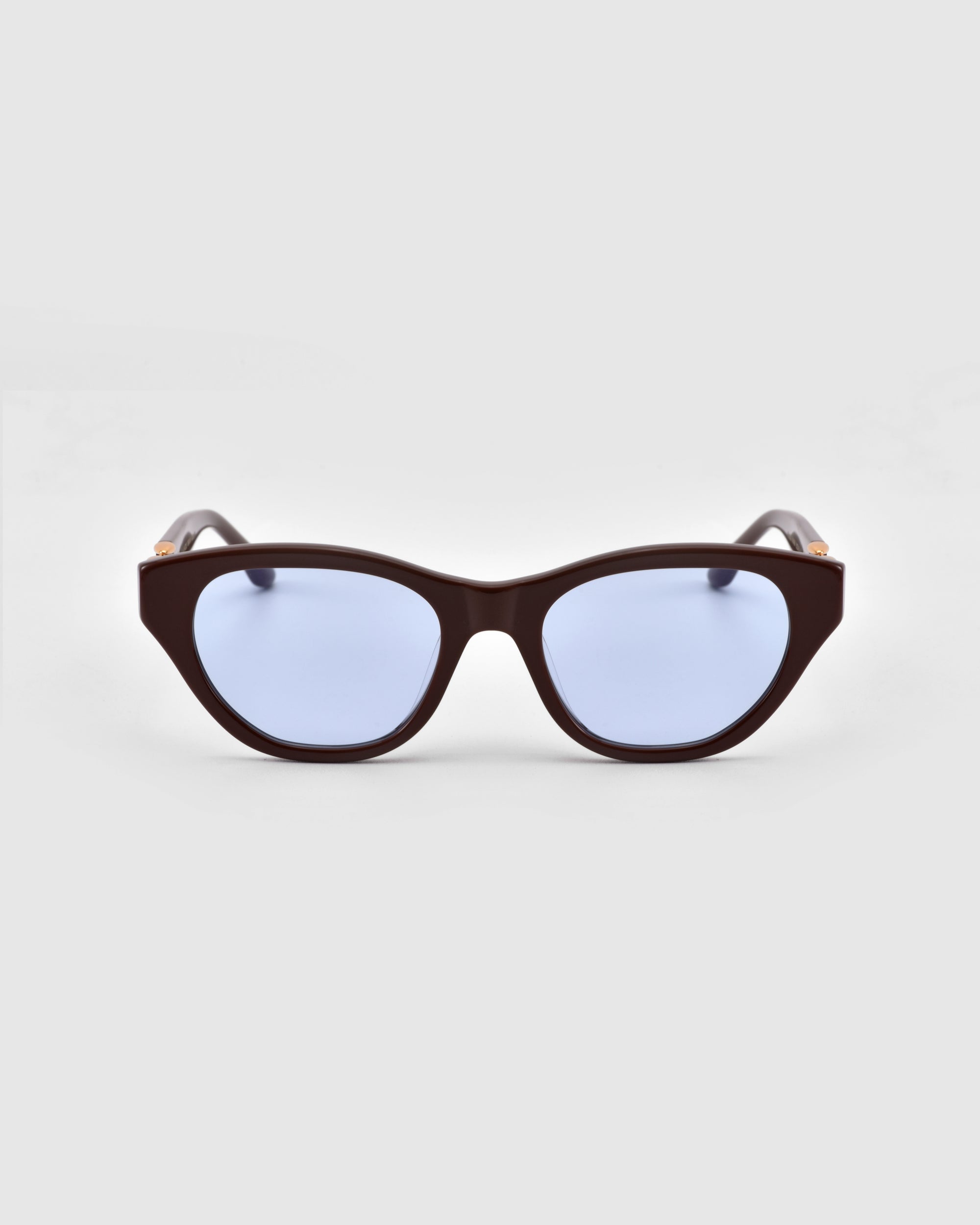 The Cuts cat-eye sunglasses by For Art's Sake® feature blue lenses.