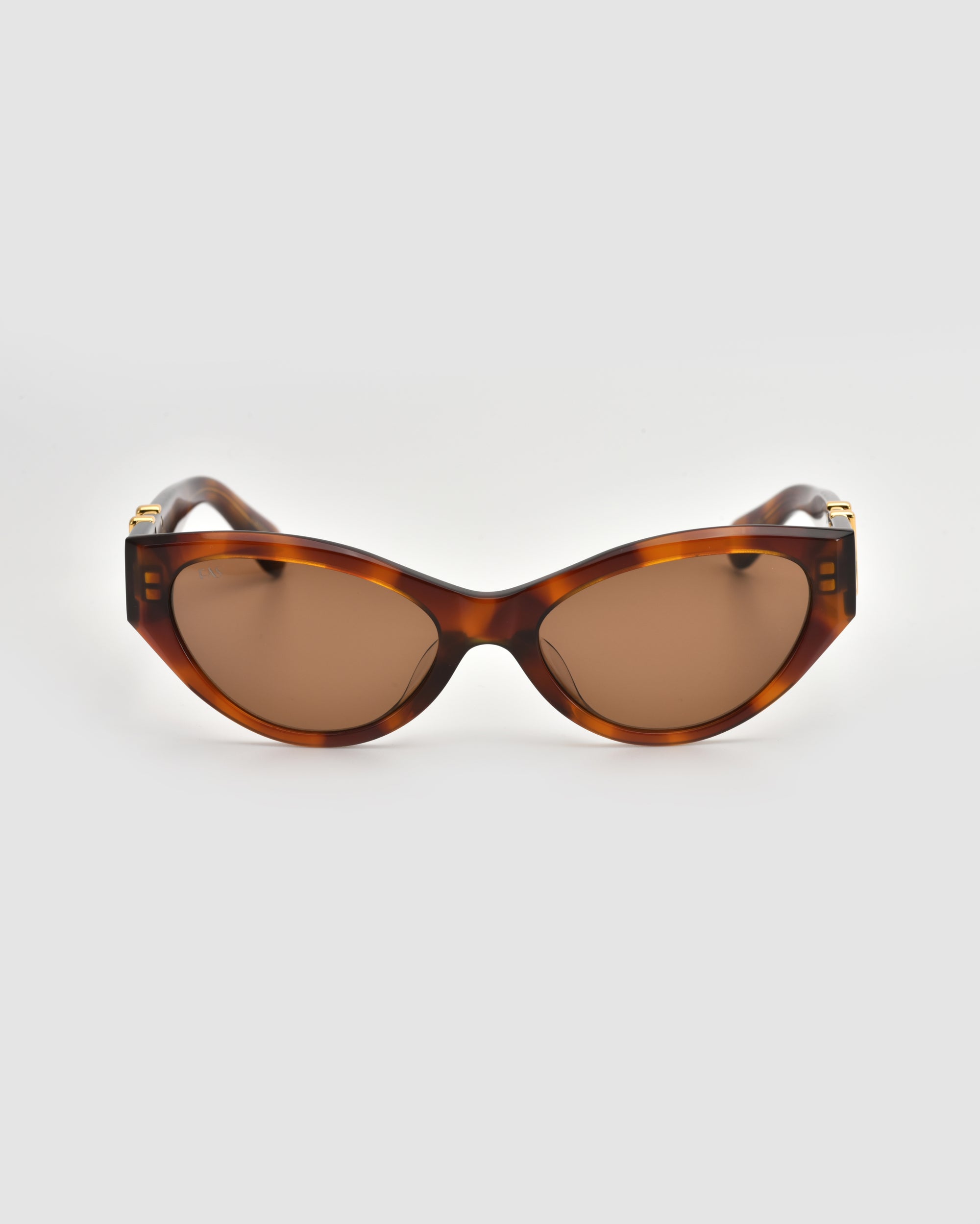 For Art's Sake® Halo(S) cat-eye sunglasses with a sculptural tortoiseshell acetate frame and brown tinted lenses, shown on a plain light gray background.