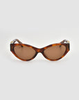 For Art's Sake® Halo(S) cat-eye sunglasses with a sculptural tortoiseshell acetate frame and brown tinted lenses, shown on a plain light gray background.
