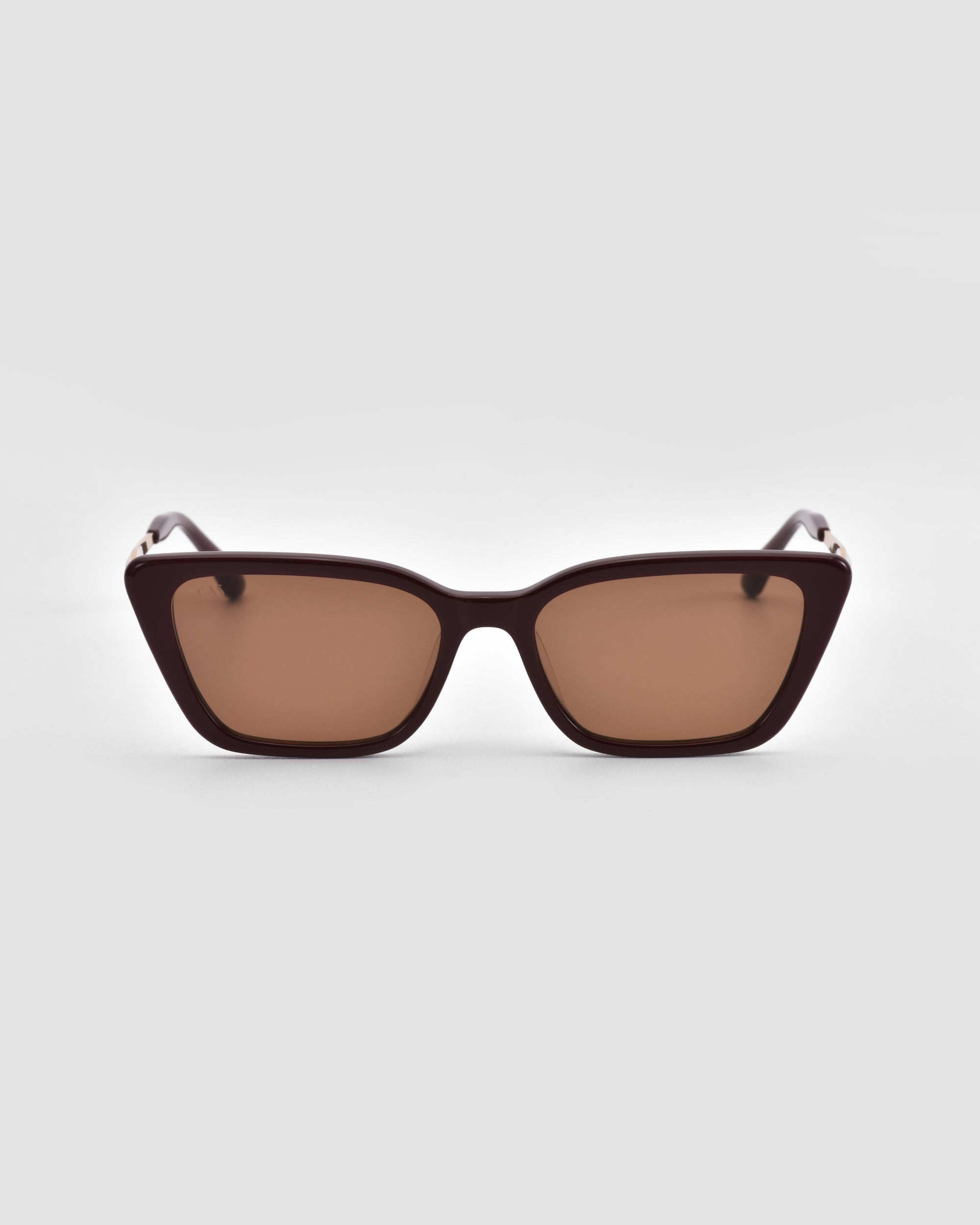 For Art's Sake® Harmony(S) rectangular brown sunglasses feature a sculptural frame with thick, dark edges and brown-tinted lenses, shown against a plain light gray background.