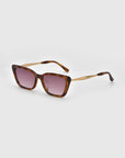 For Art's Sake® Harmony(S) sunglasses in brown tortoiseshell, featuring a boxy frame and gradient pink lenses, are displayed on a white background at an angle to showcase the front and side arms.