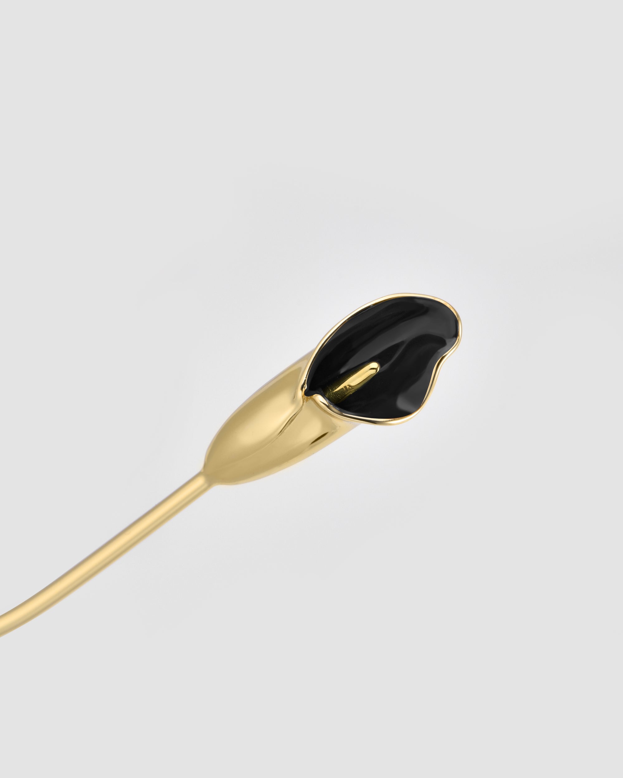 The Georgia by For Art's Sake® is a gold and black sculptural piece, inspired by stylized flora with hand-painted Calla lily tip details on a curved stem, set against a light gray background.