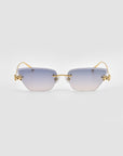 For Art's Sake® Florist rimless sunglasses feature gradient blue-to-clear lenses, a gold nose bridge and temples, and sculpted hinge accents, displayed on a plain light gray background.