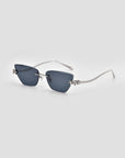 For Art's Sake® Florist: Square, rimless sunglasses with dark lenses, thin metallic arms, and sculpted floral accents by the hinges, shown on a light grey background.