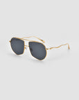 For Art's Sake® Lines sunglasses with dark rectangular lenses and a slim gold metal frame with sculpted temples, displayed on a plain light gray background.
