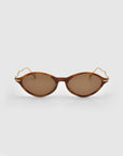 Front view of For Art's Sake® Totto sunglasses with brown cat-eye acetate and metal frames, slim gold sculpted temples, displayed on a light gray background.