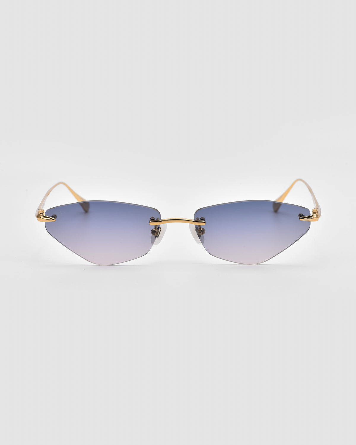 Sienna I rimless sunglasses by For Art’s Sake®, showcased on a plain white background, feature blue gradient lenses, jade stone nose pads, and thin gold temples.