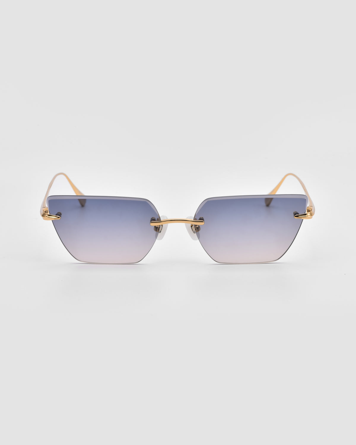 Sienna II by For Art’s Sake®: rimless cat-eye sunglasses with gradient blue lenses, thin gold arms, and jade stone nose pads shown on a plain light gray background.