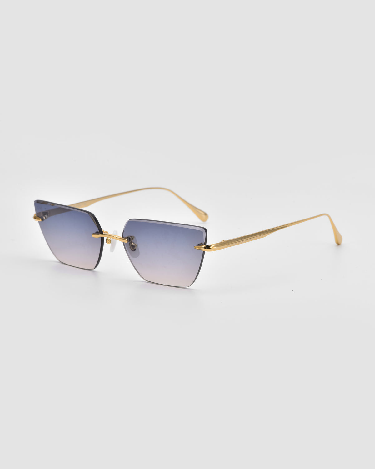 For Art’s Sake® Sienna II sunglasses with square, blue-tinted rimless lenses, jade stone nose pads, and slim gold arms displayed on a light gray background.