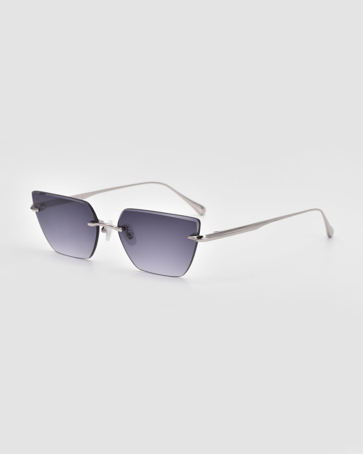 For Art’s Sake® Sienna II sunglasses feature a square shape, thin silver metal frames, jade stone nose pads, and gradient gray lenses, shown on a plain light gray background.