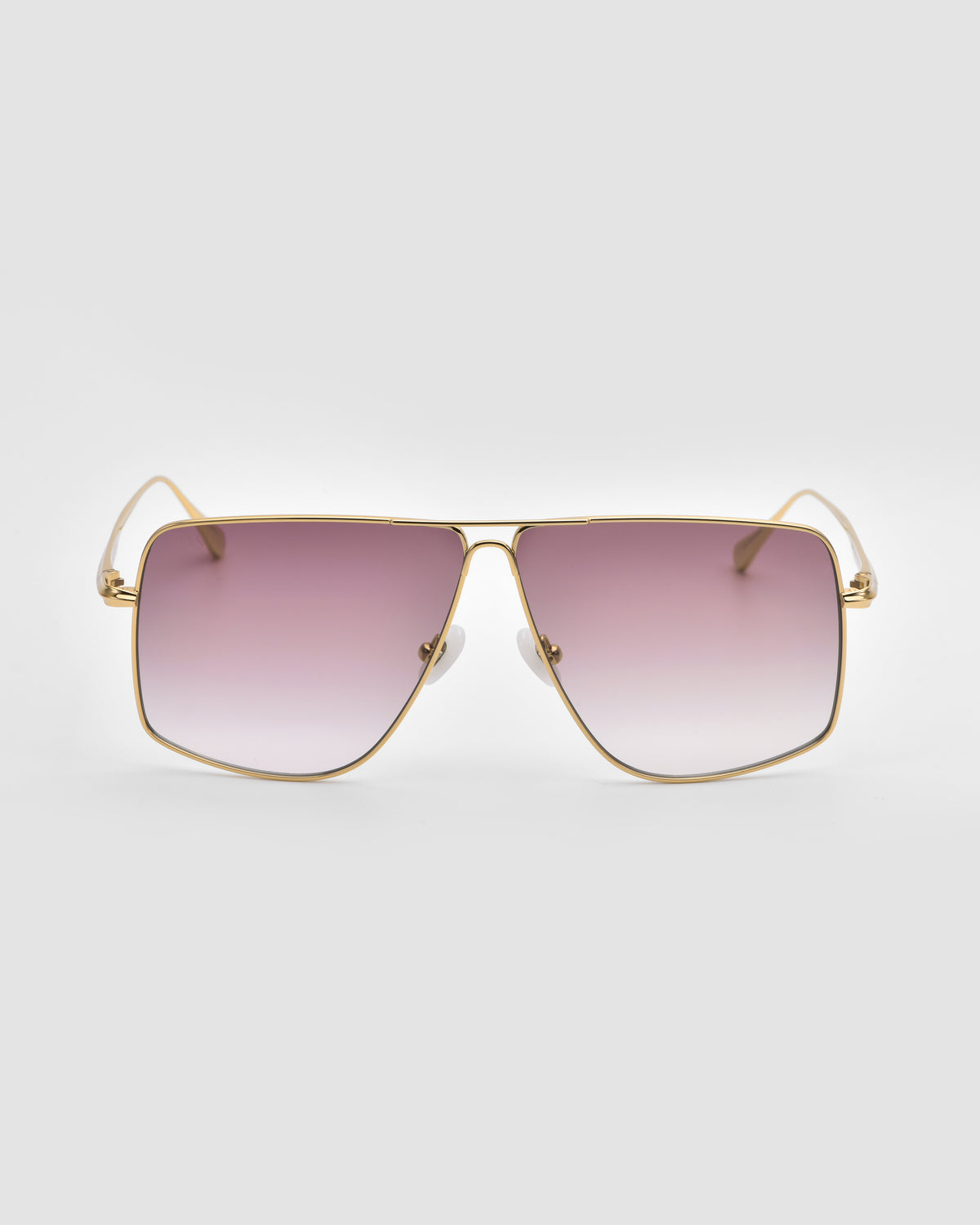 For Art’s Sake® Marisol II: Gold-framed oversized aviators with square gradient lenses fading from purple to clear, sculpted metal details, shown on a plain light gray background.