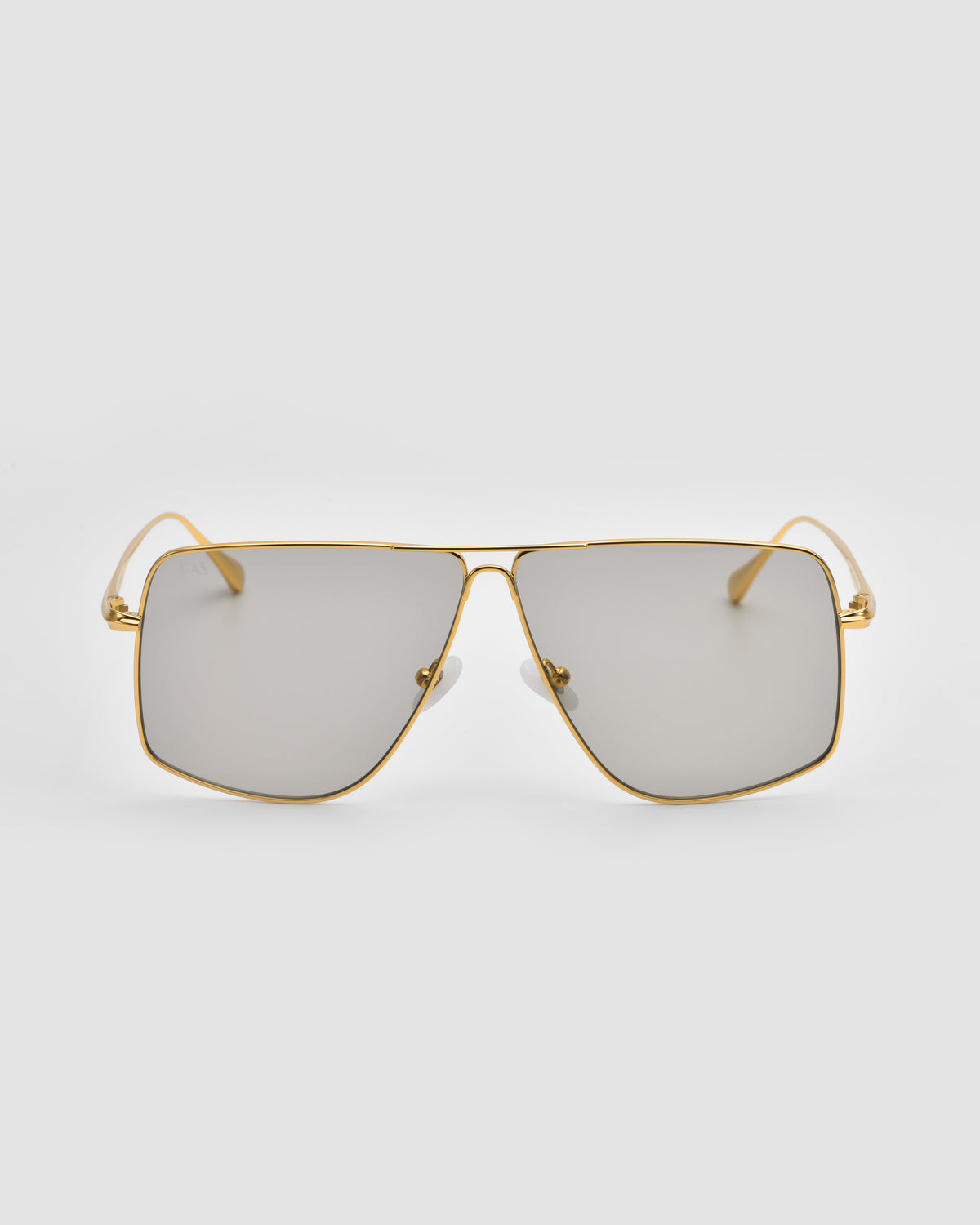 The Marisol II by For Art’s Sake® are square, gold-framed sunglasses with sculpted metal details and mirrored lenses, shown on a plain light gray background.
