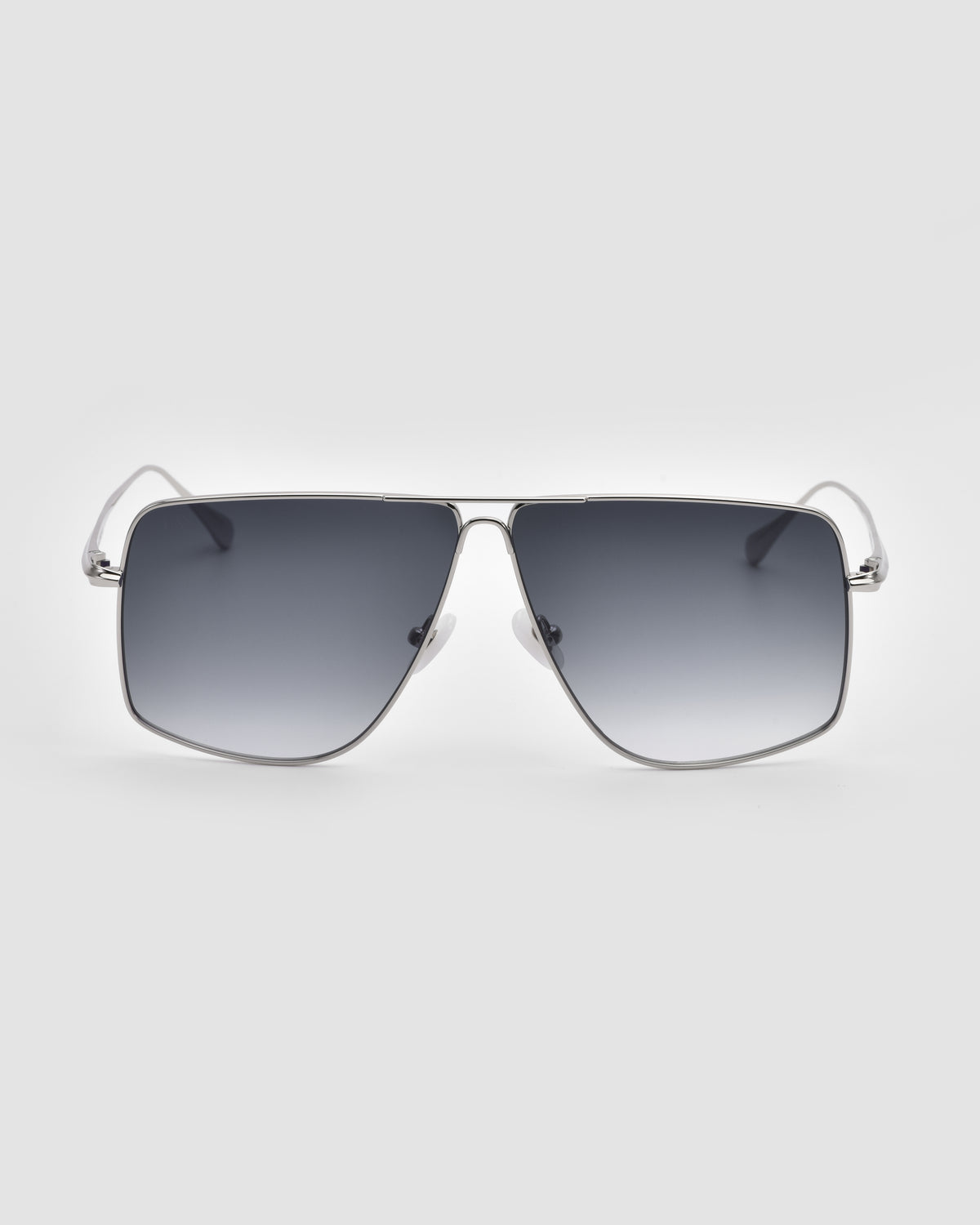 The Marisol II by For Art’s Sake® features silver oversized aviator frames with large square dark gradient lenses and sculpted metal details, displayed on a plain light gray background.