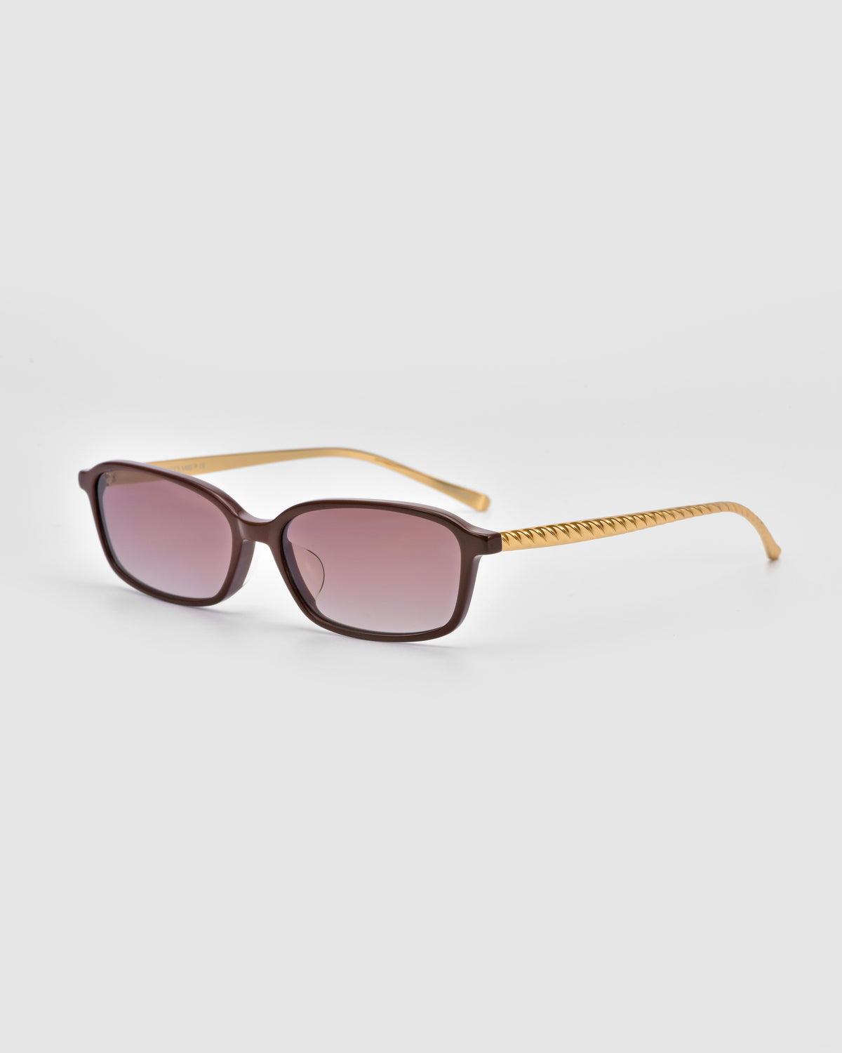 Solana I by For Art’s Sake® are brown square sunglasses with gold arms and a diagonal line pattern, offering statement-making, modern style shown on a light gray background.