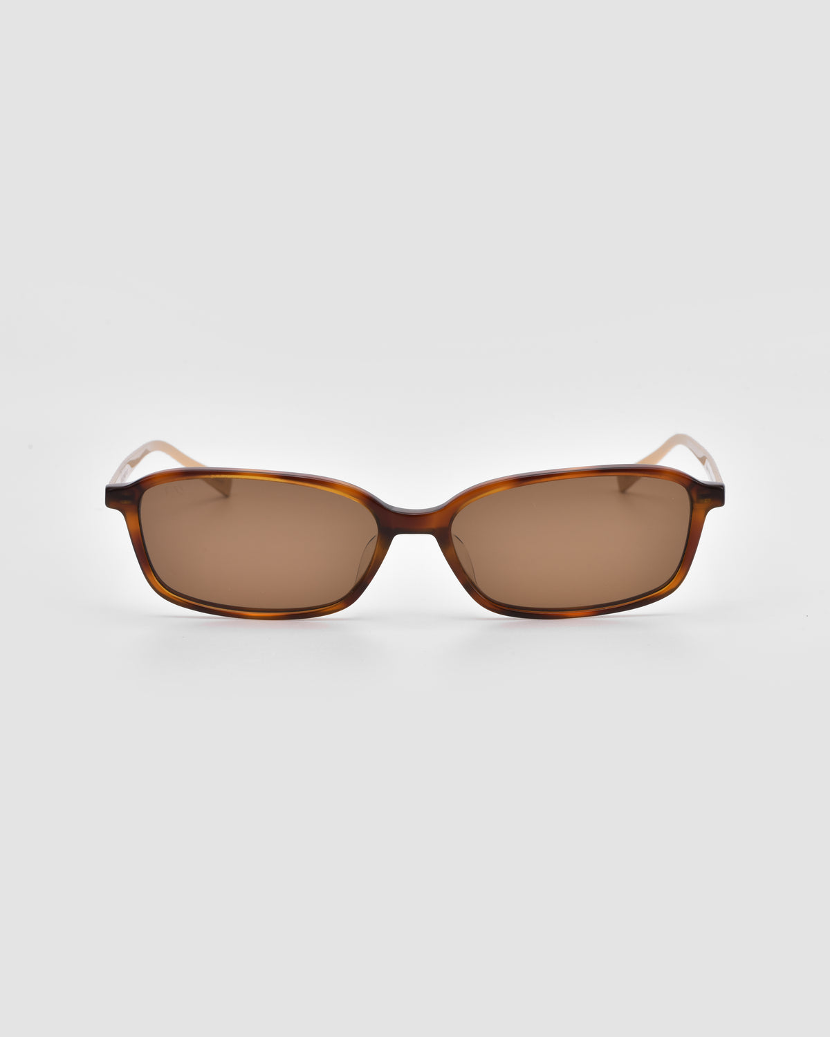 Solana I by For Art’s Sake®—brown rectangular modern sunglasses with dark lenses, shown from the front against a plain light gray background for a bold, stylish look.