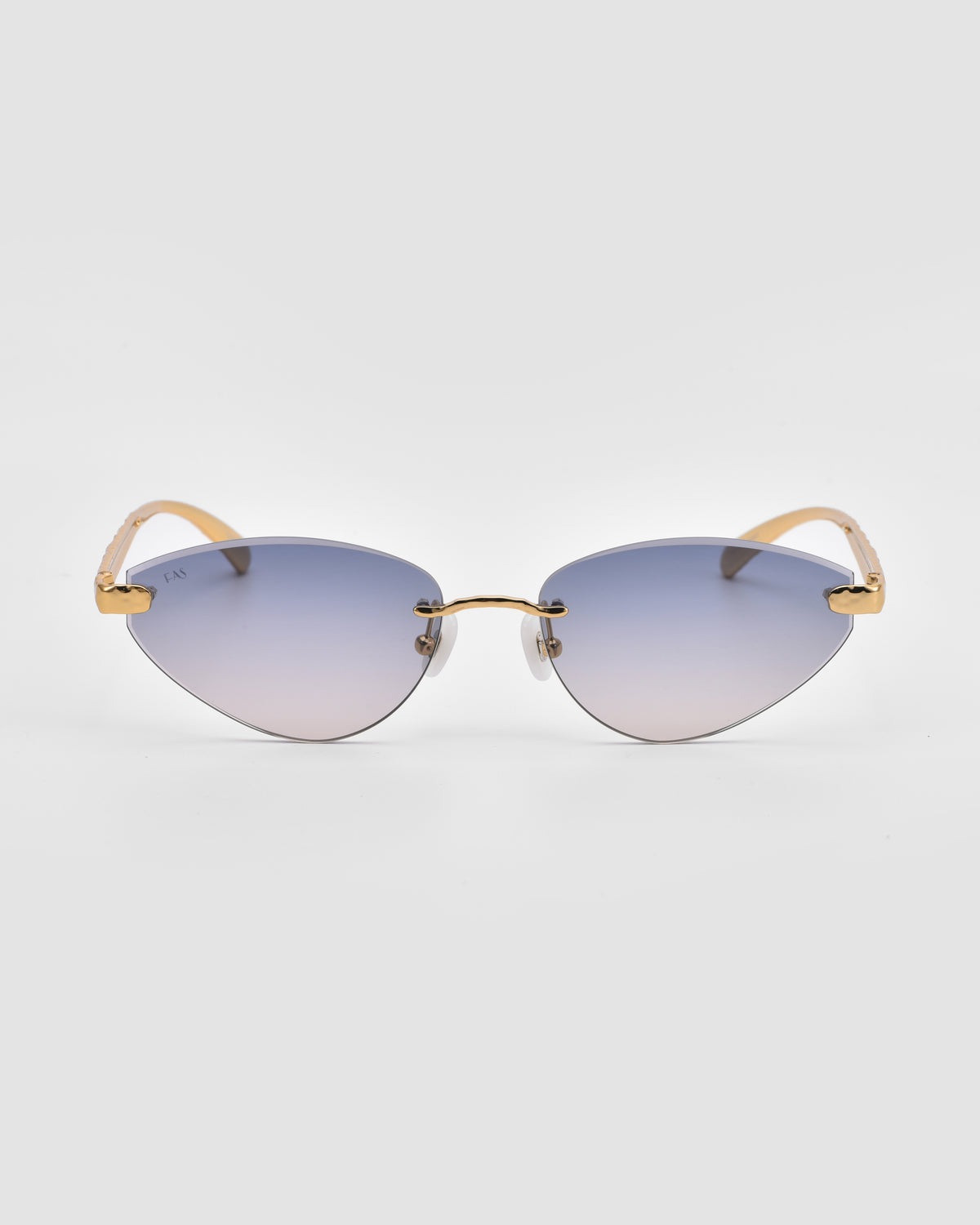 Shimmer I by For Art’s Sake®: Cat-eye rimless sunglasses with bevel-cut gradient blue-purple lenses and gold arms, shown facing forward on a plain white background.