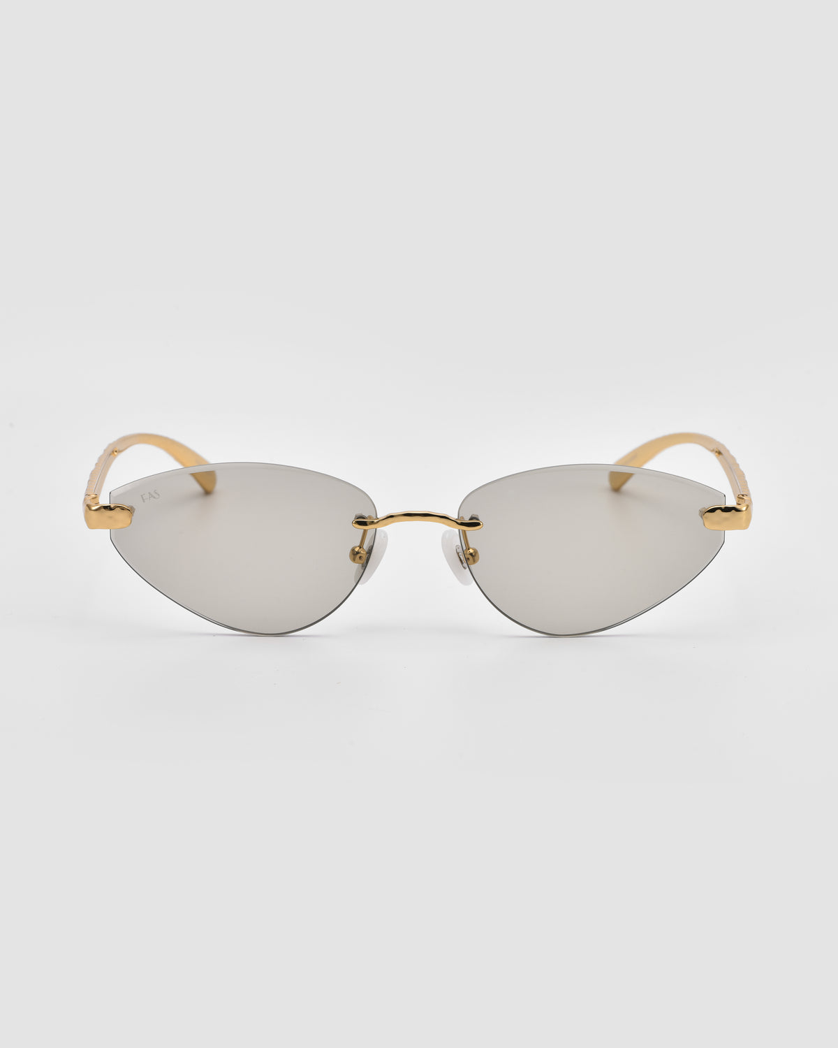 Shimmer I by For Art’s Sake®: Cat-eye rimless sunglasses with silver reflective bevel-cut lenses and gold metal arms—jewellery-inspired eyewear for a bold statement, shown on a white background.