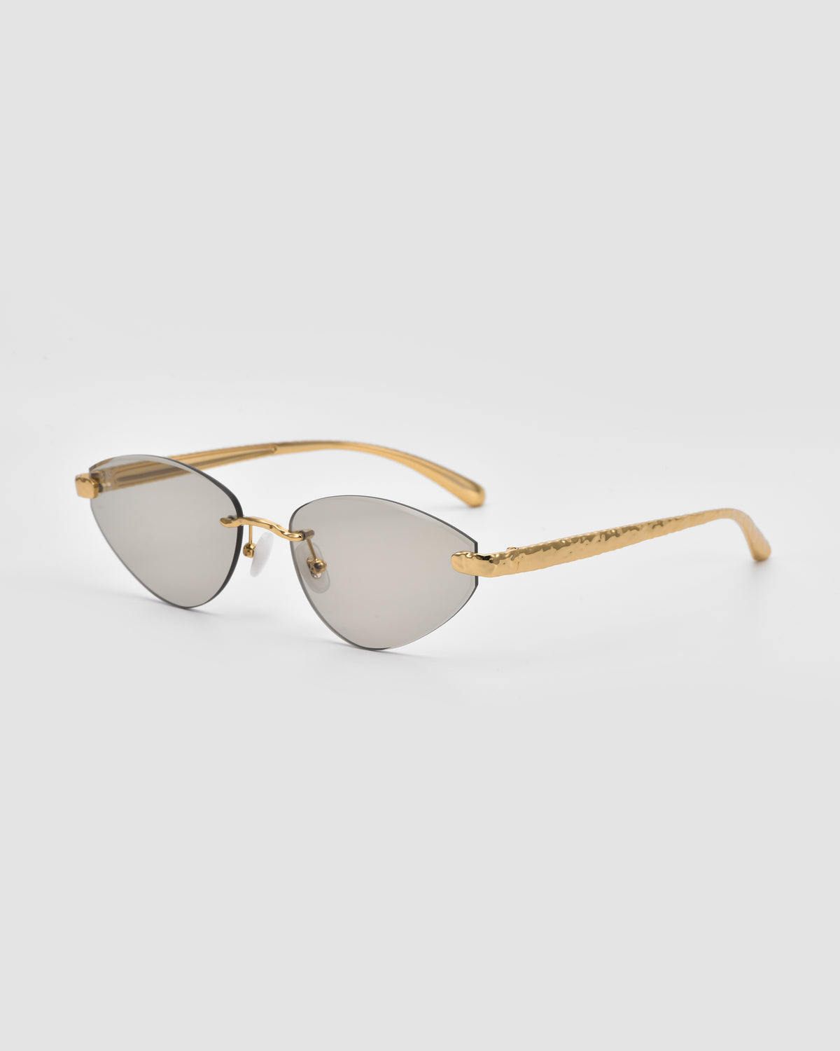 For Art’s Sake® Shimmer I sunglasses feature gold rims, reflective bevel-cut lenses, and textured gold arms, shown on a plain light gray background.