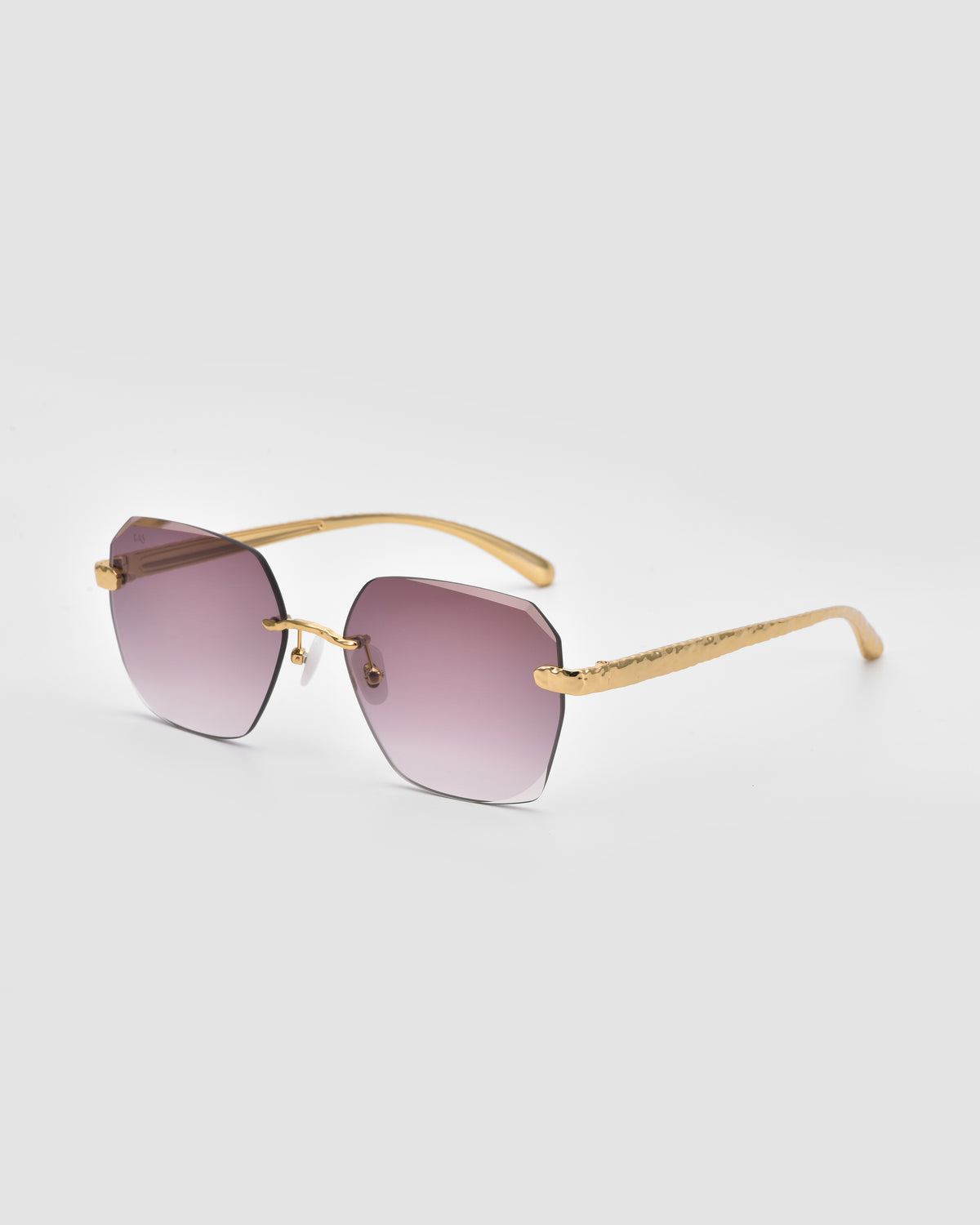For Art’s Sake® Shimmer II: Gold-framed sunglasses with square, purple gradient lenses and jewellery-inspired temples, shown on a plain light gray background.