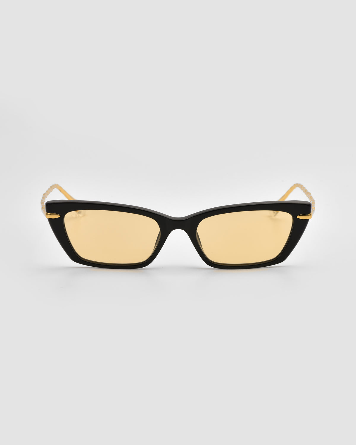 For Art’s Sake® Sol II black cat-eye sunglasses with yellow-tinted lenses and thin gold arms from the Sol State collection, shown on a plain light gray background.
