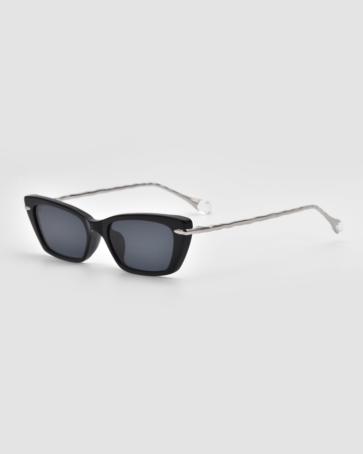 For Art’s Sake® Sol II black rectangular sunglasses with dark lenses and thin, wavy silver temples, shown on a light gray background.