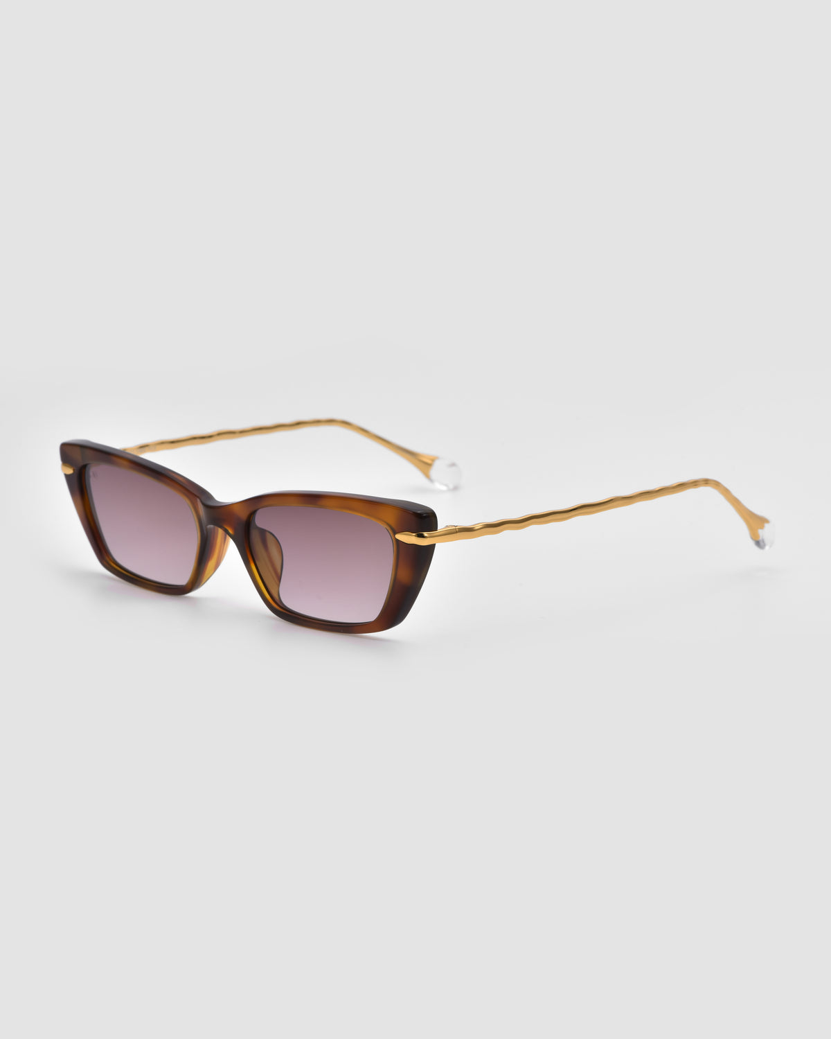 For Art’s Sake® Sol II brown tortoiseshell rectangular sunglasses with dark lenses and slim, wavy arms from the Sol State collection, shown on a light gray background.