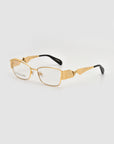 For Art's Sake® Origami eyeglasses feature a gold rectangular frame with a soft-square silhouette, geometric angular temple designs, and black-tipped arms, shown on a plain white background.
