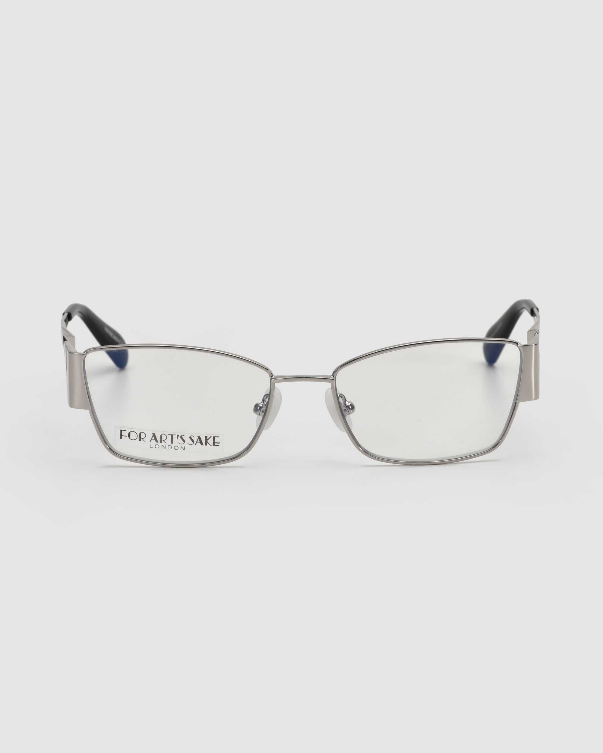 Rectangular silver metal Origami eyeglasses by For Art's Sake®, with clear lenses, black temple tips, and a soft-square silhouette. Shown upright on a white background; the left lens reads "FOR ART'S SAKE LONDON.