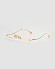 The Waver by For Art's Sake® features minimalistic rimless oval frames with thin gold metal temples, showcased against a white background.