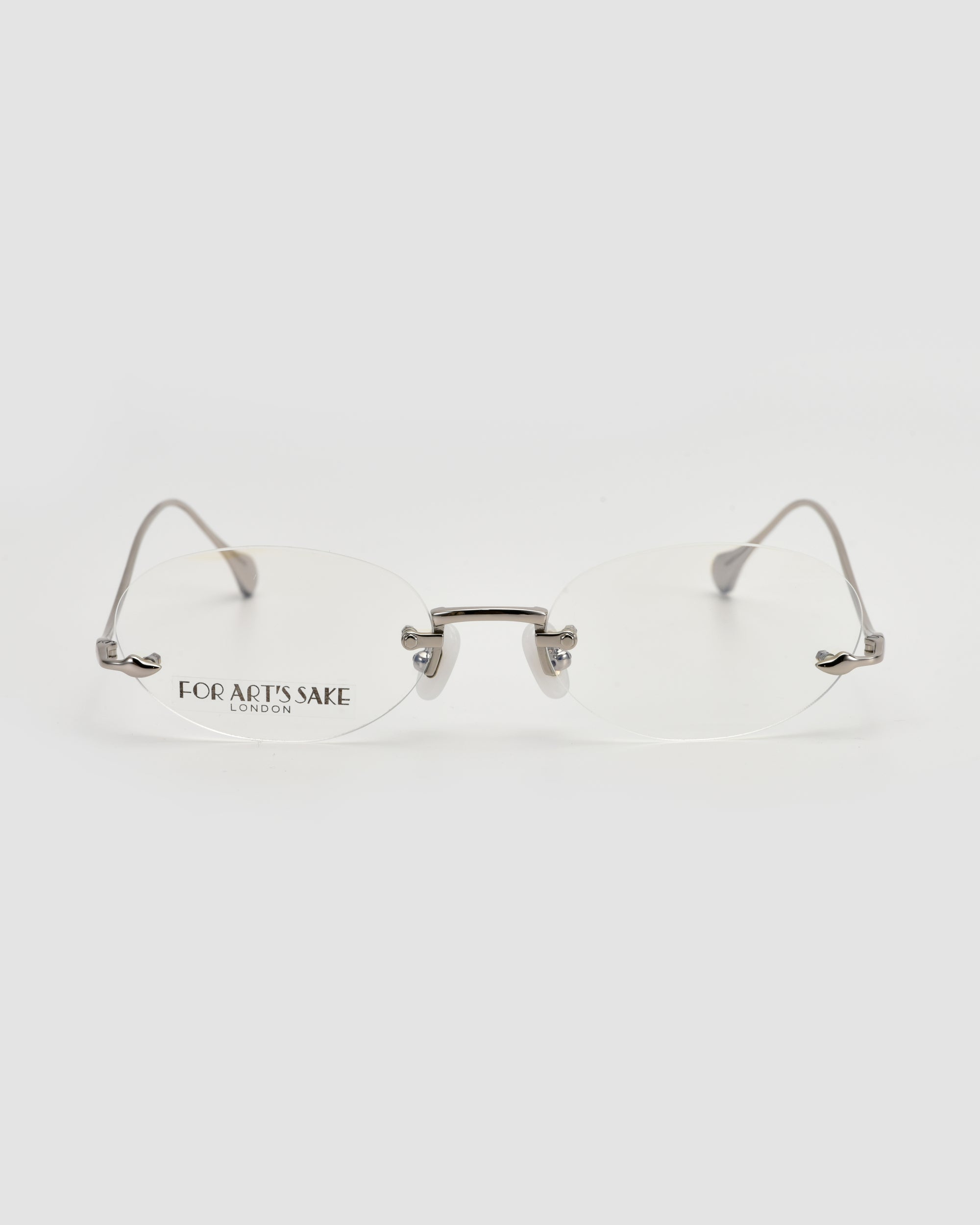 Waver by For Art's Sake®: minimalist rimless eyewear with thin metal arms, a subtle nose bridge, and the brand logo on the left lens—shown against a plain white background.