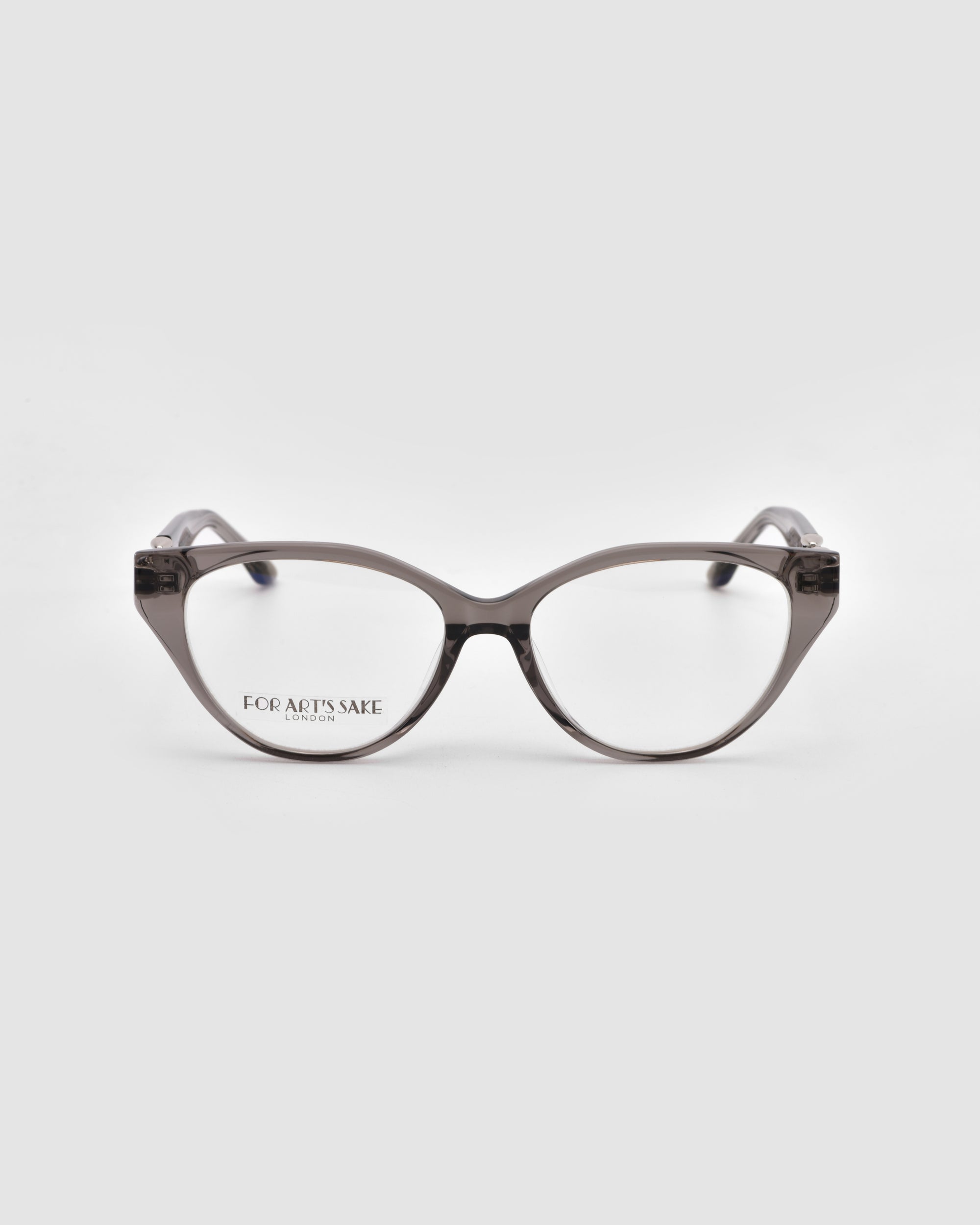 The Act by For Art's Sake®: gray, translucent cat-eye eyeglasses with clear lenses and a lightweight frame, shown on a white background. "FOR ART'S SAKE" appears on the left lens.