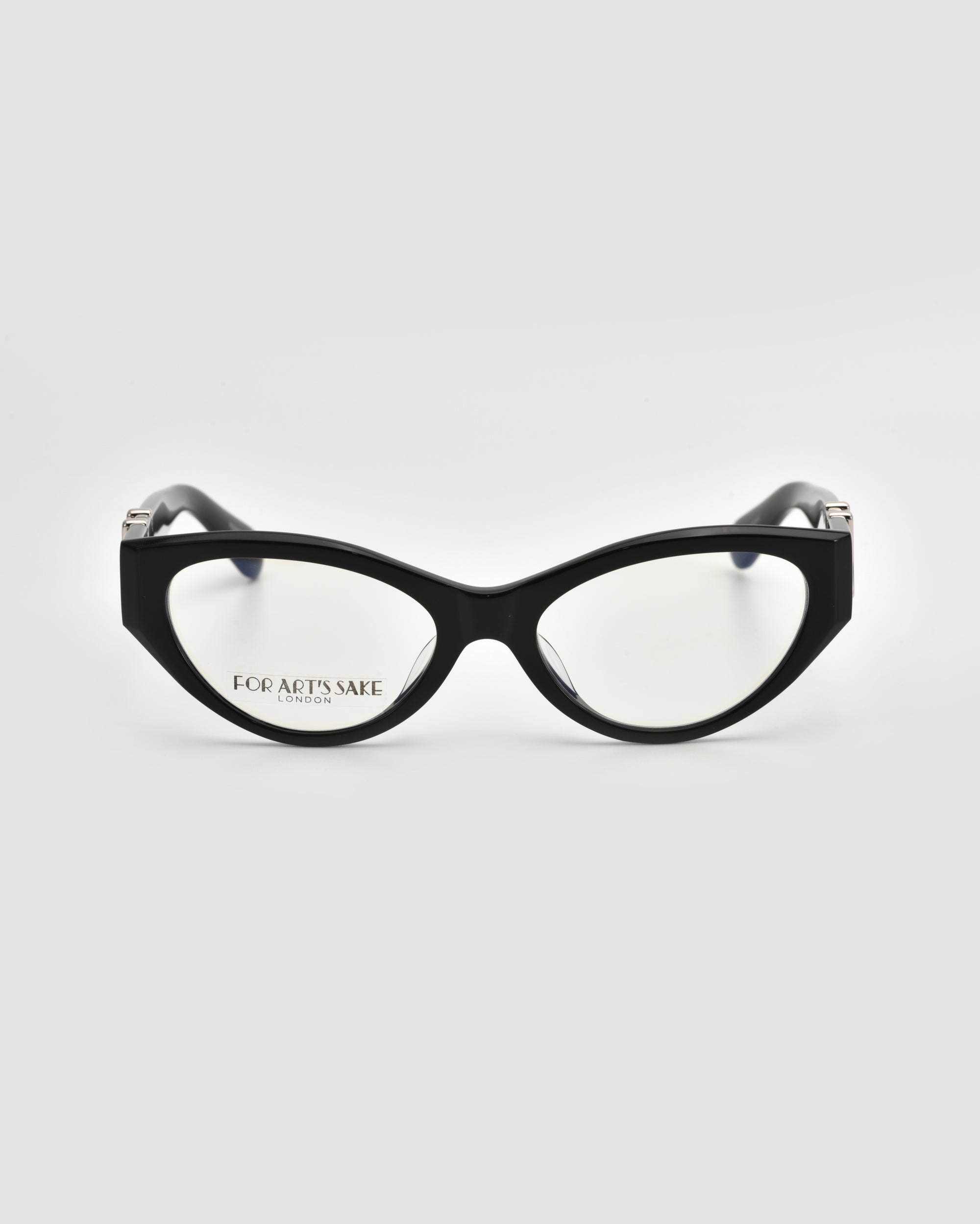 A pair of black Halo(X) cat-eye eyeglasses with clear lenses and sculptural acetate frames, shown on a light gray background. The thick frames feature the For Art's Sake® brand name on the left lens.