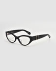 The Halo(X) by For Art's Sake® are black cat-eye eyeglasses with a sculptural acetate frame and decorative silver temple accents, shown on a white background.