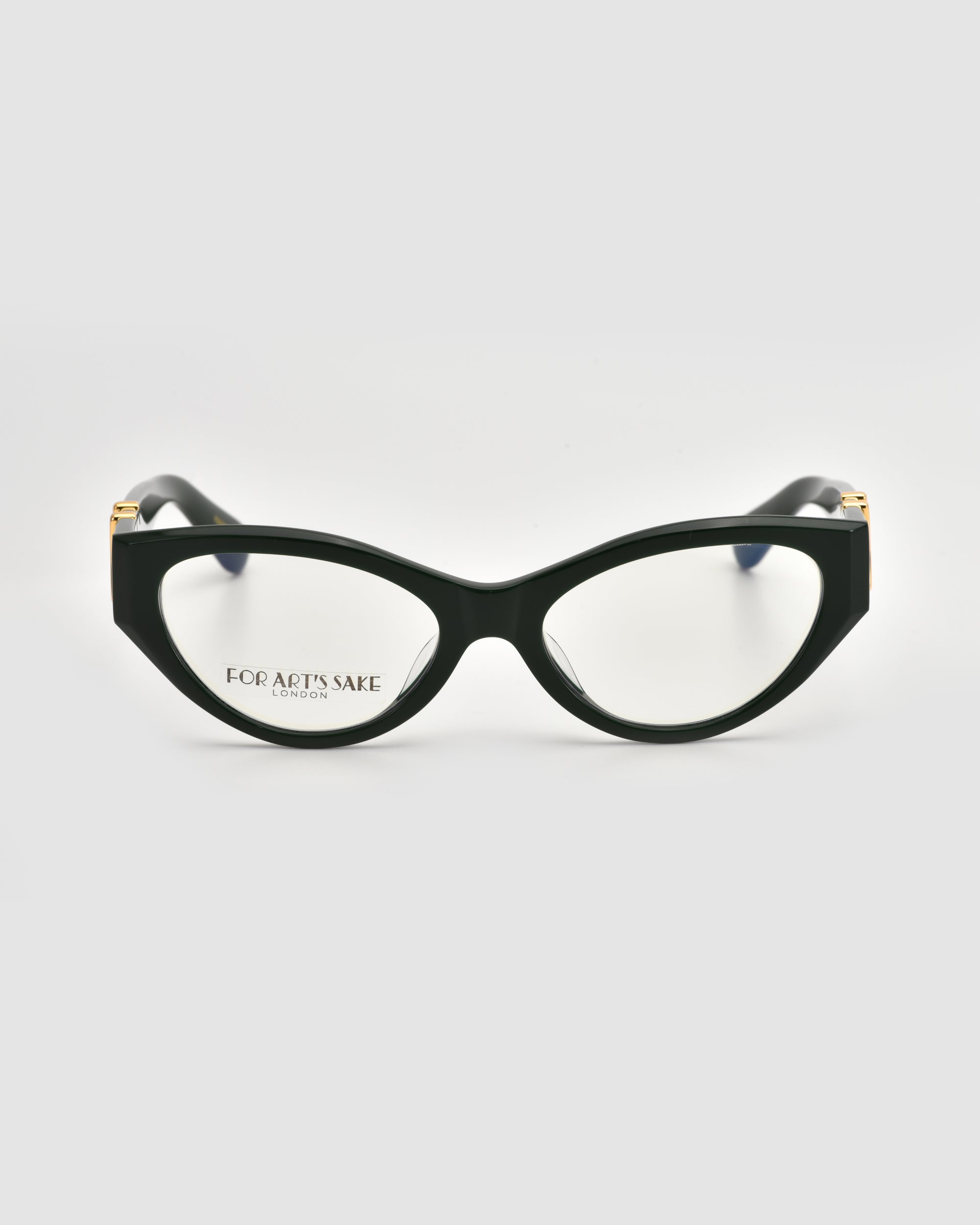 The Halo(X) by For Art’s Sake® features black cat-eye eyeglasses with sculptural acetate frames and clear lenses. "FOR ARTS SAKE LONDON" is printed on the left lens, shown front-facing against a plain white background.
