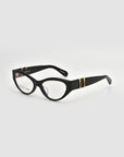 For Art's Sake® Halo(X) features black cat-eye eyeglasses with sculptural acetate frames, thick gold-accented temples, and clear lenses—chic everyday eyewear—shown on a light gray background.