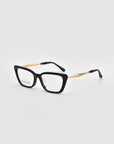 The Harmony(X) eyeglasses by For Art's Sake® feature a black rectangular frame with sculptural temples and black tips, shown on a light gray background.
