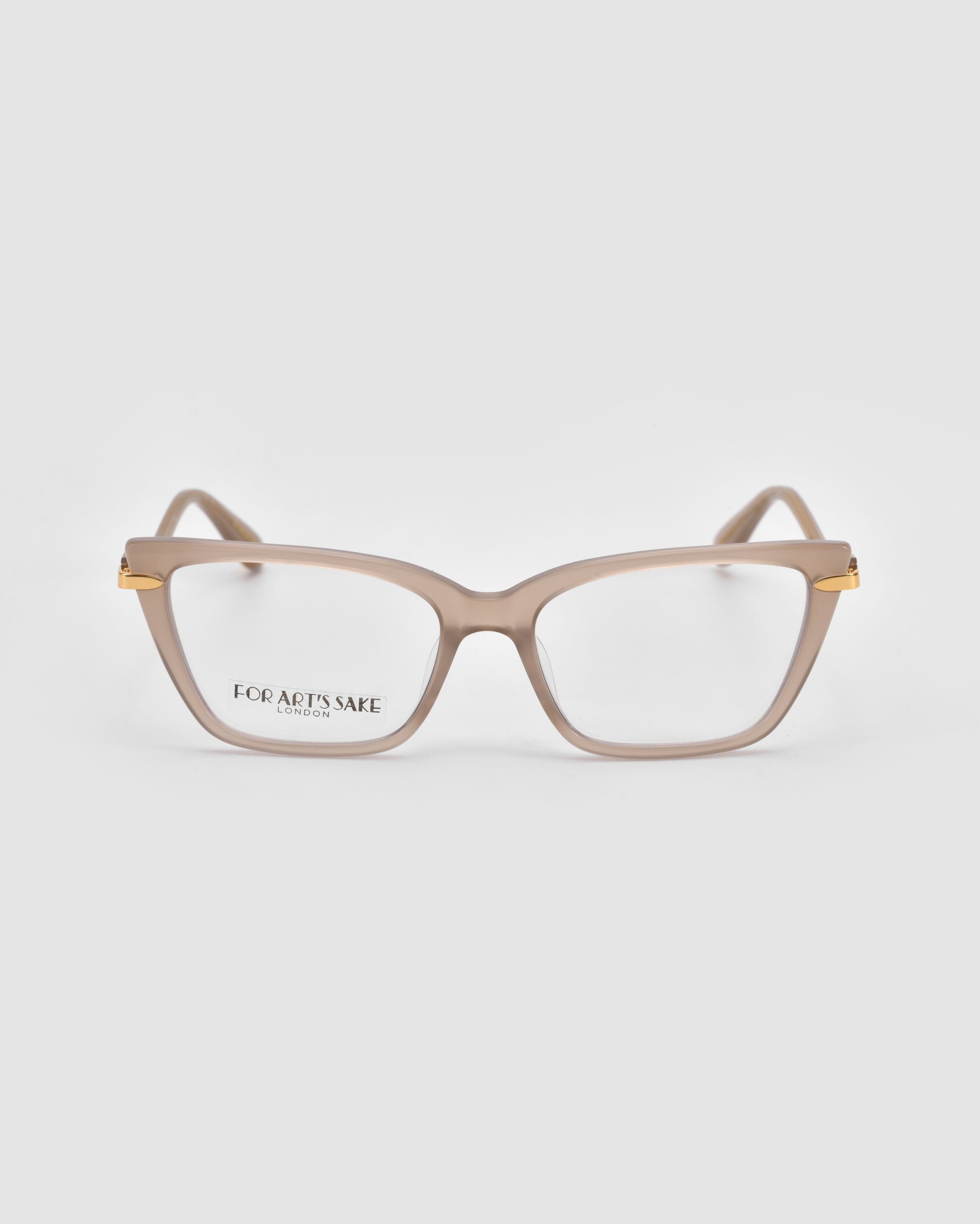 Motion I by For Art's Sake®: Beige rectangular eyeglasses with gold metal hinge accents and acetate temples, shown on a plain light gray background. "FOR ART'S SAKE LONDON" is printed on the left lens.