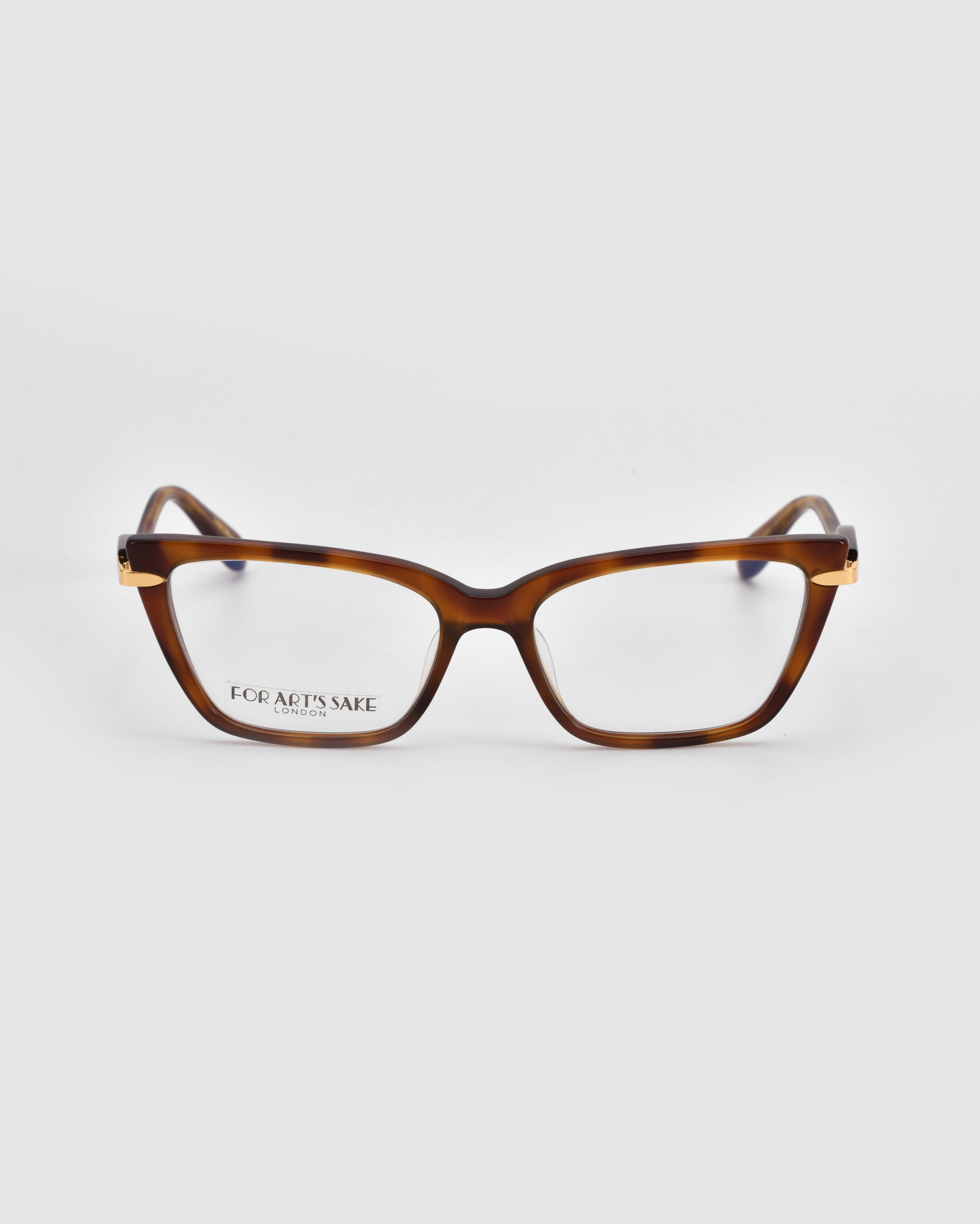 The Motion I eyeglasses by For Art's Sake® feature brown tortoiseshell rectangular thick frames with subtle metal accents, shown on a white background. "FOR ART’S SAKE" is inscribed in small text on the inside left lens.