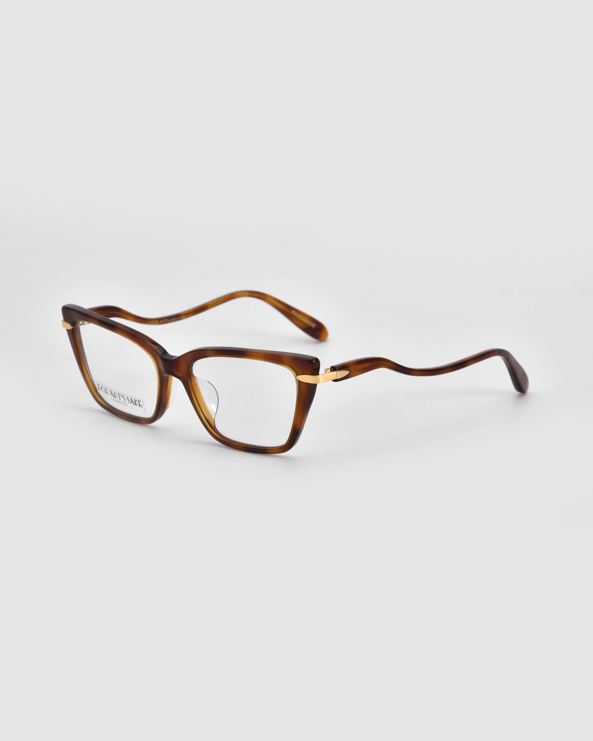 The For Art's Sake® Motion I eyeglasses feature brown tortoiseshell rectangular frames with a slight cat-eye shape and sleek acetate temples, displayed angled on a plain white background.