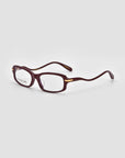 The For Art’s Sake® Motion II sunglasses feature a boxy rectangular shape in dark red, gold metal hinge accents, and curved acetate temples, shown on a light grey background.