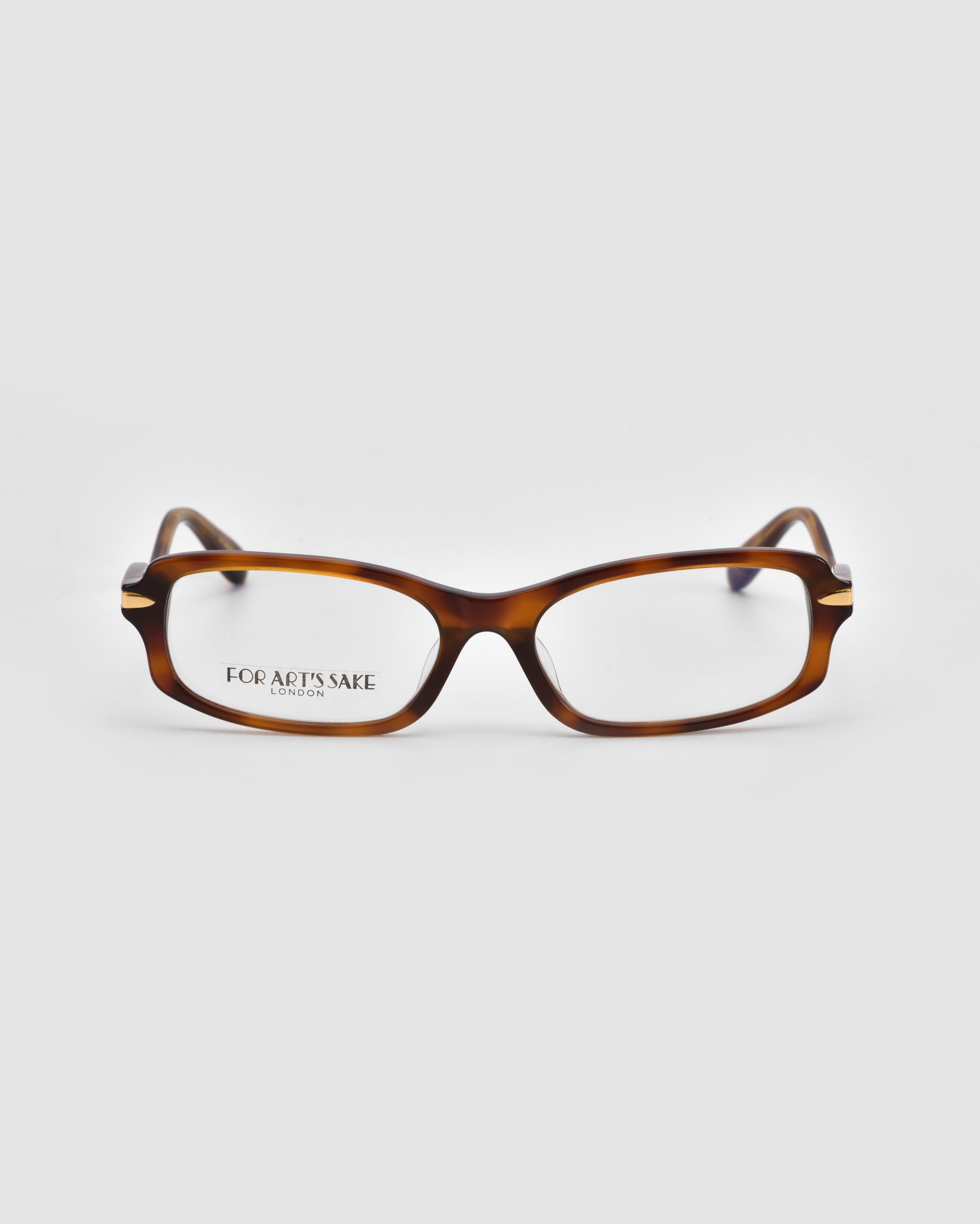 A pair of rectangular brown tortoiseshell Motion II eyeglasses by For Art's Sake®, featuring clear lenses and curved acetate temples, displayed on a plain white background. "FOR ARTS SAKE" is inscribed inside one lens.